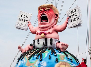 Trump auf der Weltkugel. Foto: Greenpeace