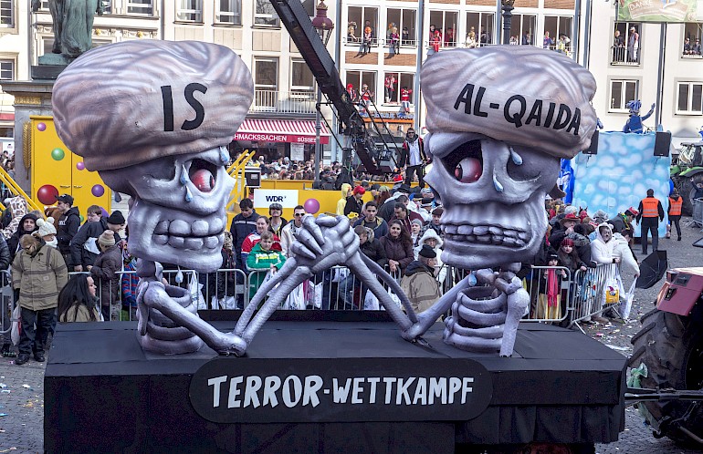 Karikatur: IS und Al Quaida im Terror-Wettkampf